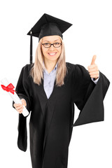 Wall Mural - Young female student holding a diploma and giving thumb up