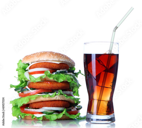 Obraz w ramie Huge burger and glass of cold drink, isolated on white