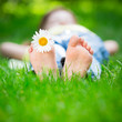 Child lying on grass
