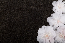 White Flowers On Black Background With Sequins