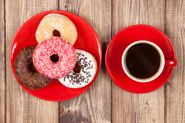 Tasty donut with a cup of coffee