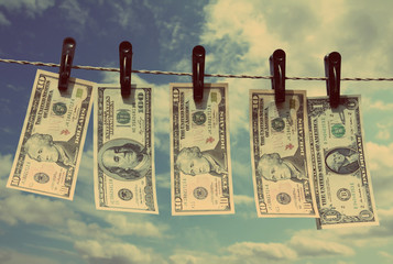 paper dollars are drying on rope - vintage retro style