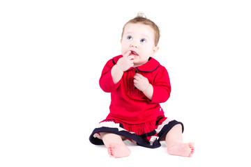 Wall Mural - Little baby girl in a red dress