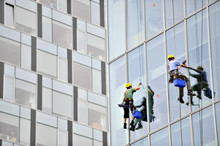 Window Washers Working On Office Building