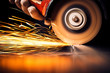 © fotomaximum - Worker cutting metal with grinder. Sparks while grinding iron