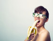 © 2mmedia - woman with nerd glasses and banana