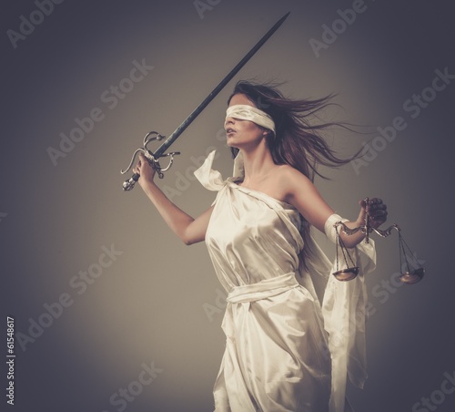 Fototapeta na wymiar Femida, Goddess of Justice, with scales and sword