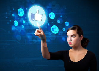 Poster - Young businesswoman pressing thumbs up button on modern social n