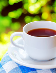 Canvas Print - Cup of tea on nature background