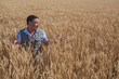© Ryzhkov Oleksandr - Happy smiling caucasian  old farmer standing in wheat fields