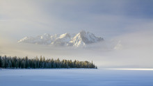 Idaho Mountain Lake With Snow And Fog In Winter
