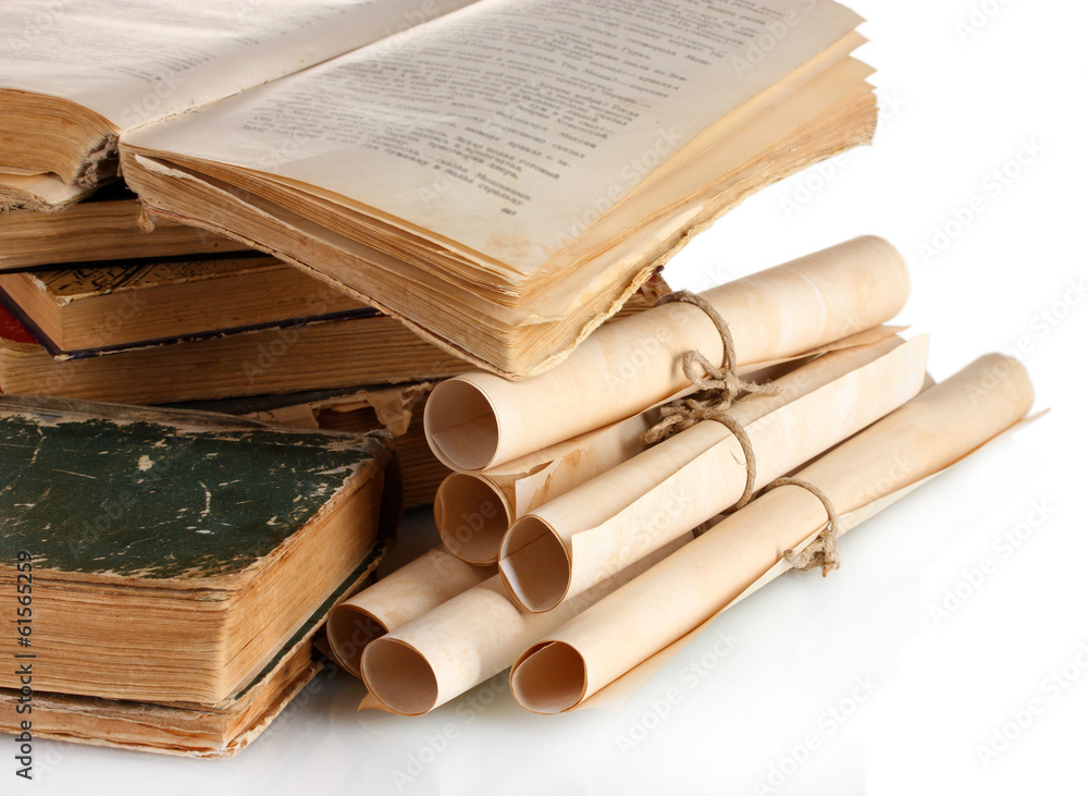 Pile of old books and scroll isolated on white