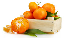 Ripe Tasty Tangerines With Leaves In Wooden Box Isolated