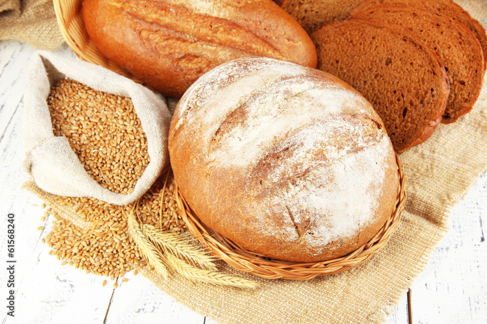 Rye bread with grains on sackcloth on table close up