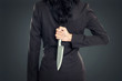© Odua Images - Business woman Holding Knife Behind His Back