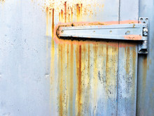 Rusty Metallic Hinge On Door