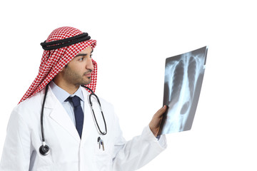 Wall Mural - Arab saudi emirates doctor man looking a radiography diagnosing