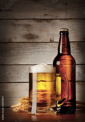 Fototapeta do kuchni Mug of lager beer with a bottle