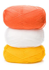 Wall Mural - stack of yarn skeins in yellow, orange, white colors on white ba