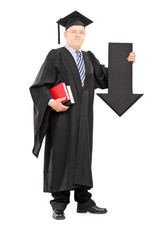 Poster - Mature man in graduation gown holding big arrow pointing down