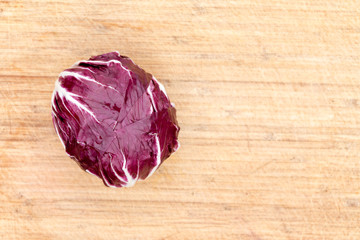 Red radicchio on a bamboo board