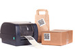 © zavgsg - .barcode printer and packaging boxes marked with a bar code