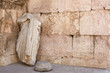Roman statue and ancient wall background in Jordan