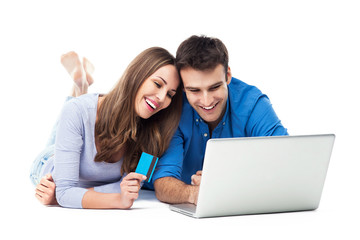 Canvas Print - Couple Using Bank Card Online With a Laptop