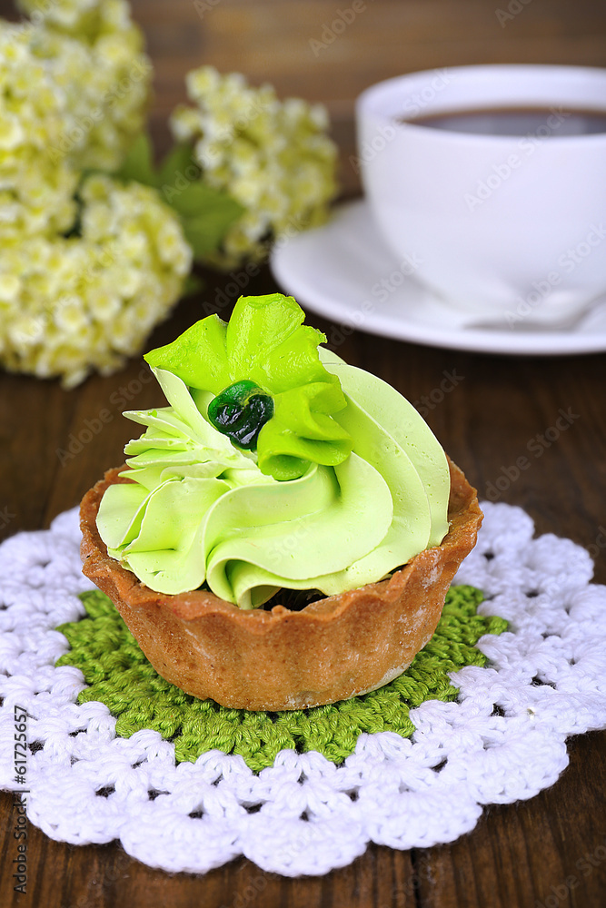 Tasty cake on table on wooden background