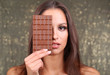 Portrait of beautiful young girl with chocolate