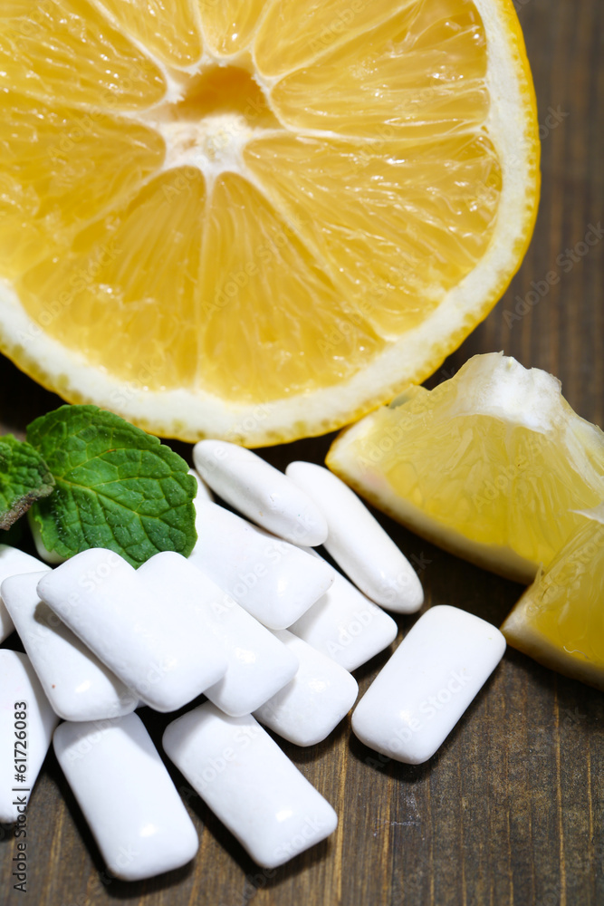 Chewing gums with fruit taste,   on color wooden background