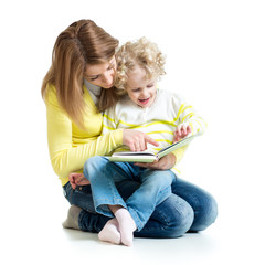 young mom reading a book to her daughter