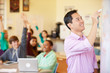 © Monkey Business - High School Students With Teacher In Class Using Laptops