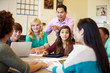 © Monkey Business - High School Students With Teacher In Class Using Laptops