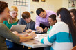 © Monkey Business - High School Students With Teacher In Class Using Laptops