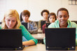 © Monkey Business - Group Of High School Students In Class Using Laptops