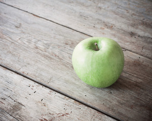 green apple on wooden background