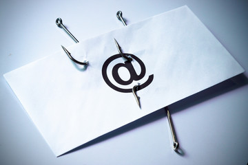 Wall Mural - phishing / fish hook in an envelope / email phishing