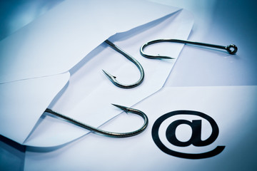 Wall Mural - phishing / fish hook in an envelope / email phishing
