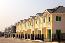 A Row Of New And Colorful Townhouses