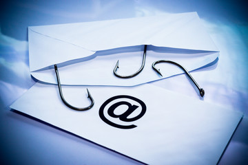 Wall Mural - phishing / fish hook in an envelope / email phishing
