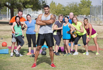 Confident Instructor with Fitness Class