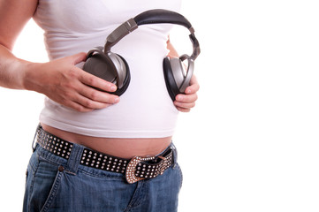 Pregnant woman belly with headset