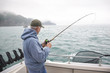 Senior man fishing for salmon in Alaska