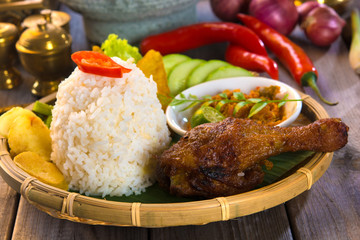 Sticker - indonesian fried chicken rice on traditional background