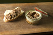 Venison pate with bread on wooden board