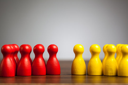 Opposition groups concept, toy pawn figures
