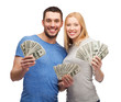 © Syda Productions - smiling couple holding dollar cash money