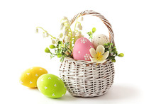 Easter Eggs In Basket Isolated On White Background