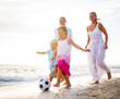 © Rawpixel.com - Family Playing on the Beach